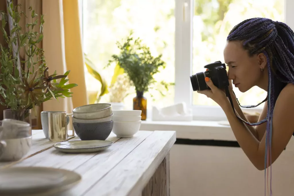 Woman photographing furniture